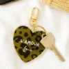 porte clés l'amour fou graou vert/noir